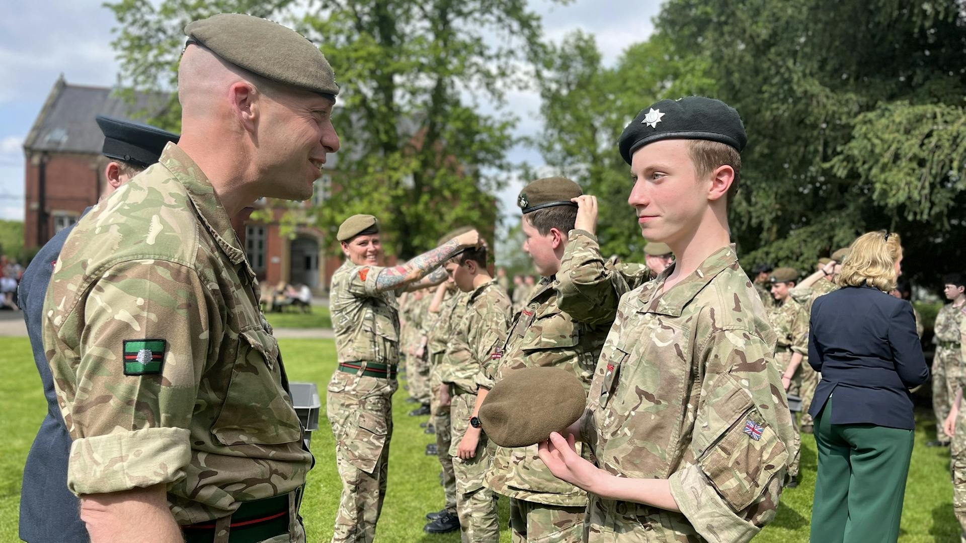 Capbadges and Berets handed to the Army Contingent