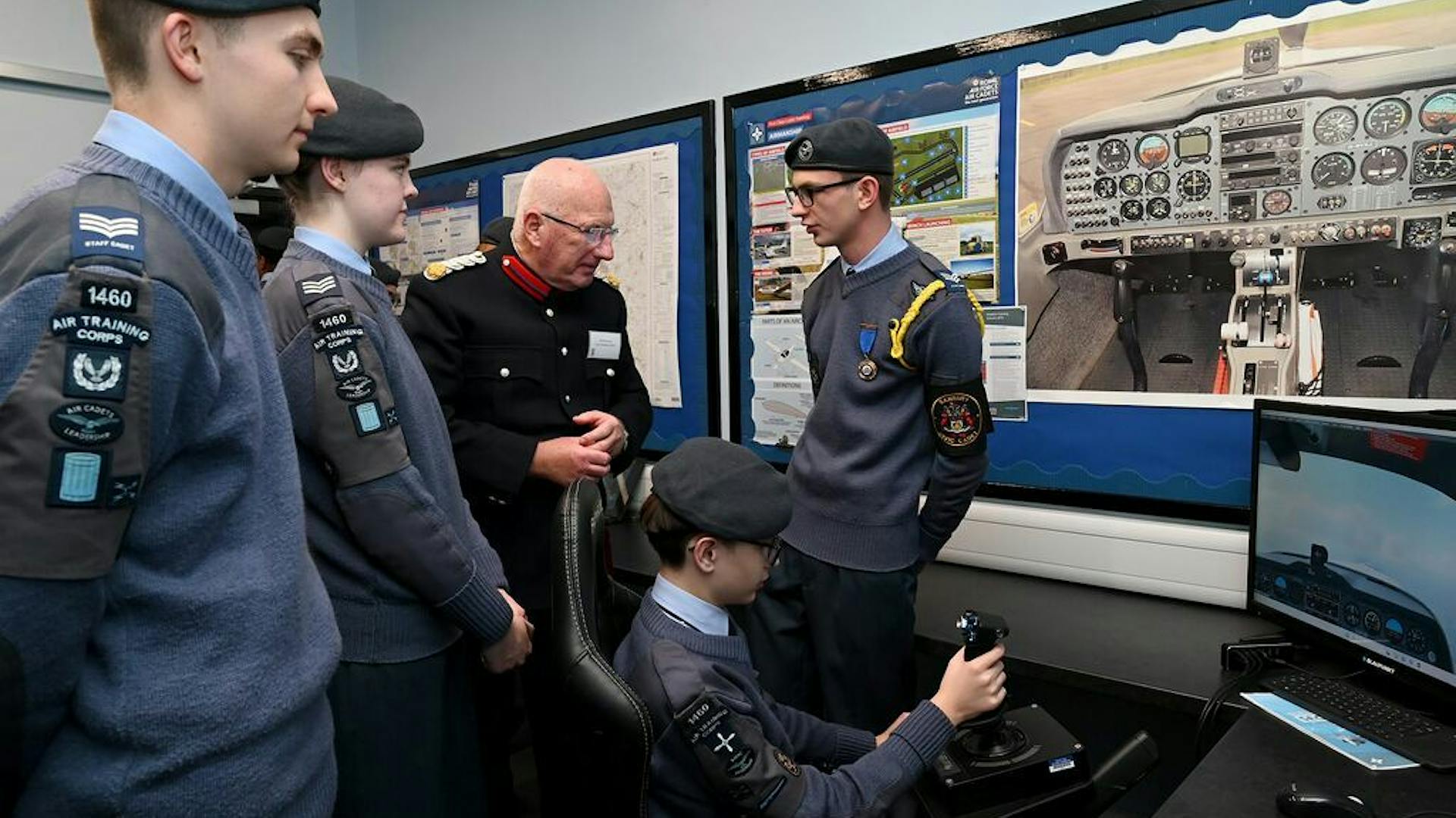 Cadets gathered around new equipment